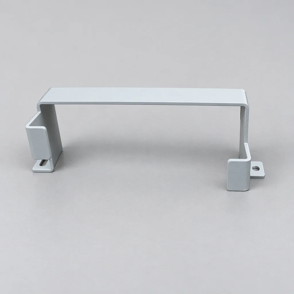 A single white bent sheet metal bracket on a plain background